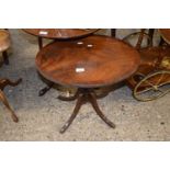 An oval topped mahogany veneered reproductin wine table