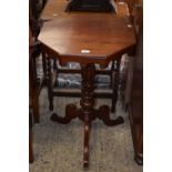 A Victorian mahogany octagonal topped wine table with turned column and tripod base