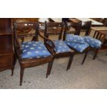 A set of four 19th Century hard seat dining chairs