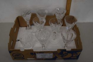 A box of various Waterford drinking glasses