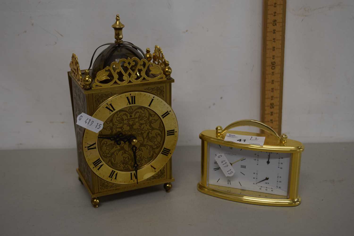 Two 20th Century battery operated clocks, one with combination thermometer and humidity gauge