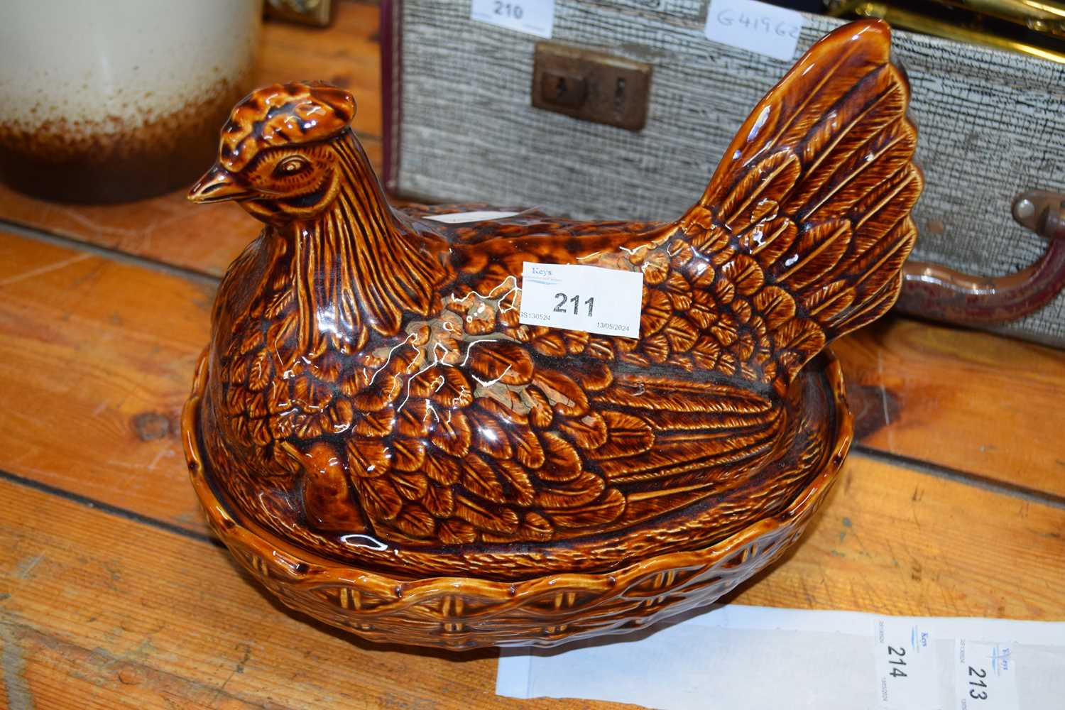 A Portmeirion brown glazed hen shaped egg container