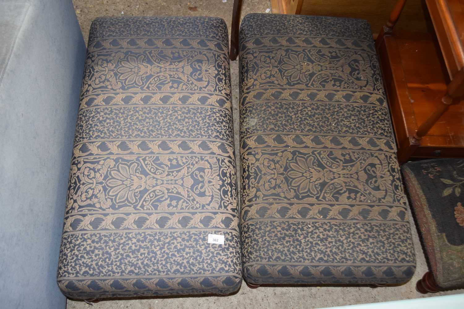A pair of modern floral upholstered rectangular footstools