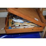 A Windsor & Newton portable artists easel with brushes and paints