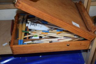 A Windsor & Newton portable artists easel with brushes and paints