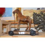 A pull-along toy horse
