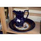 A blue and gilt decorated plate together with a blue glazed jug