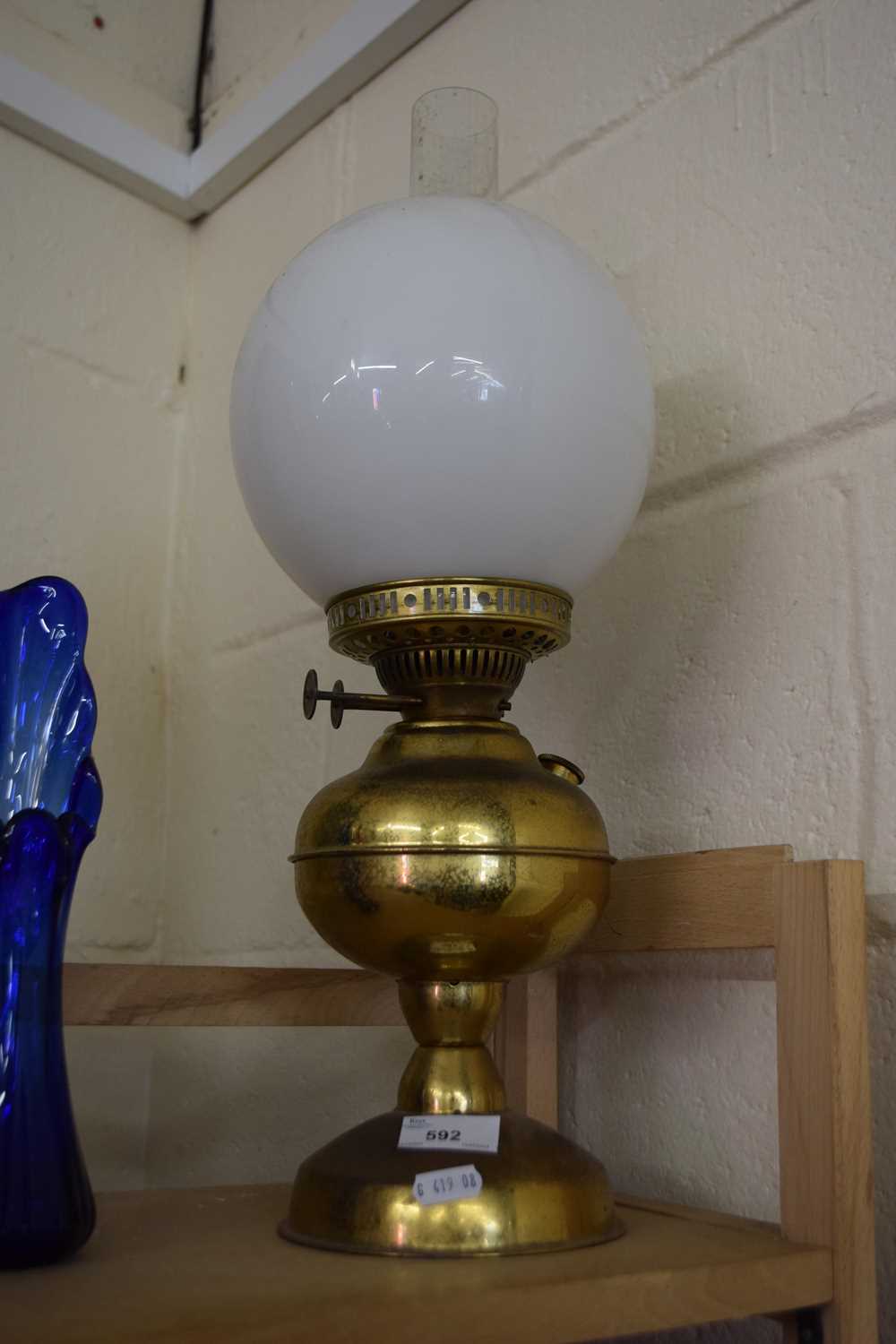 Oil lamp with white glass shade