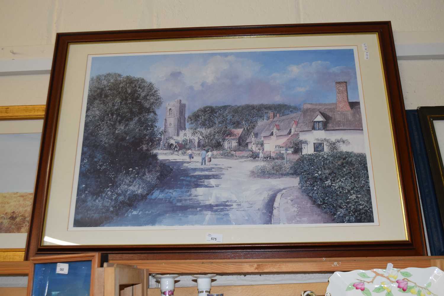 Village lane with thatched cottages and Church beyond, reproduction print, framed and glazed