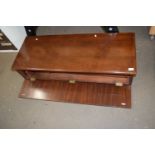 A narrow mahogany cabinet, possibly a wardrobe top box