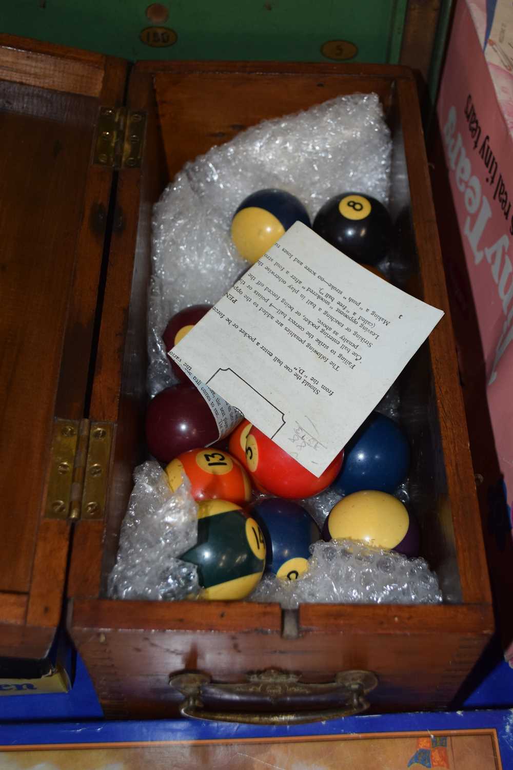 Wooden box and a quantity of pool balls
