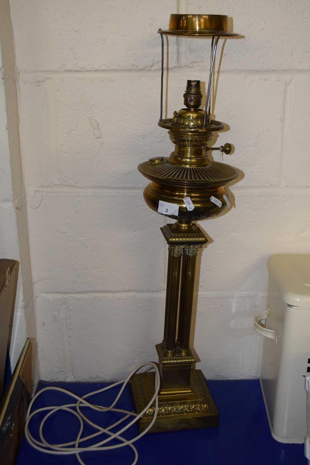 A brass former oil lamp converted to electricity