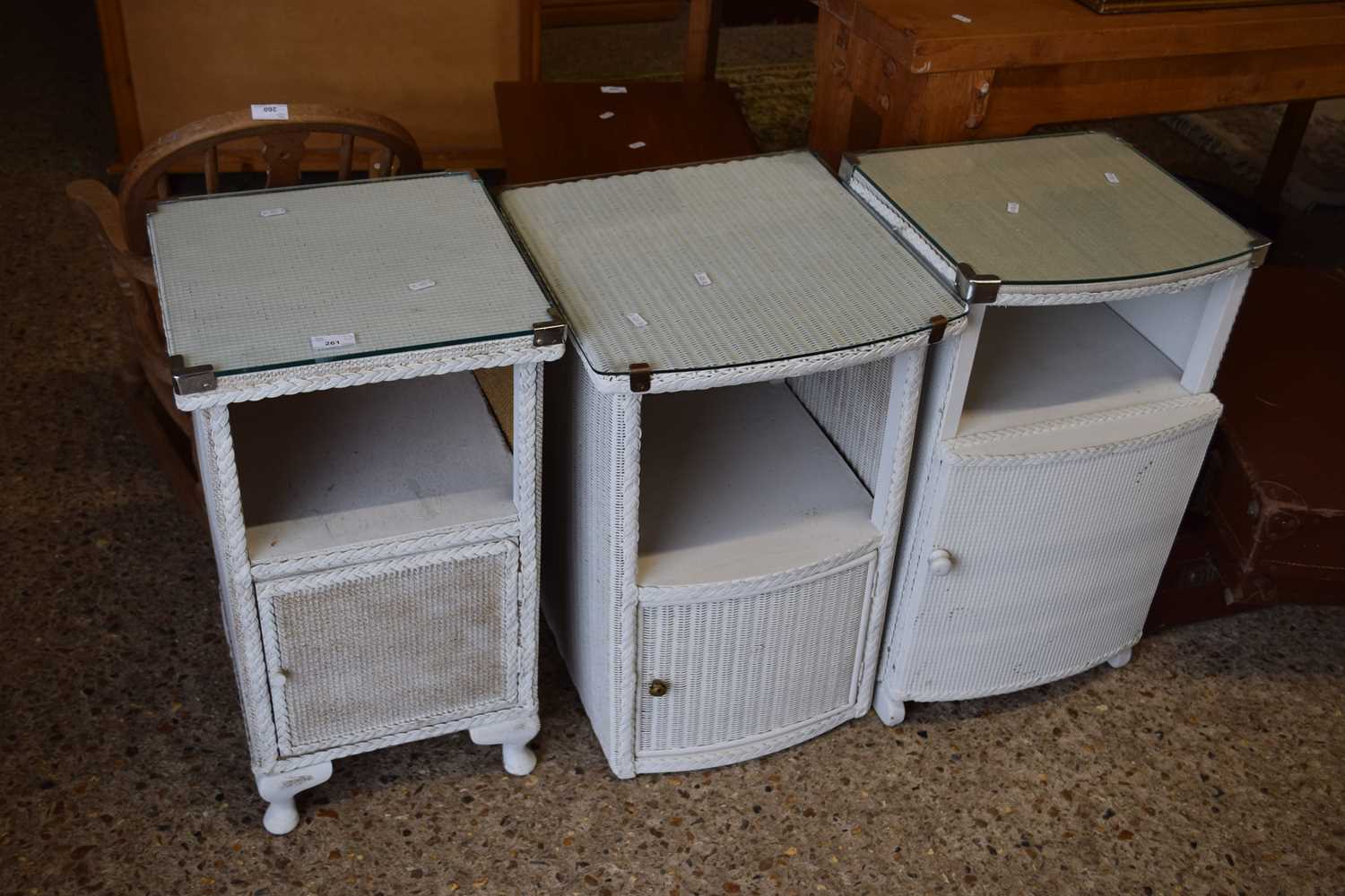 A group of three various white painted bedside cabinets