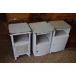 A group of three various white painted bedside cabinets