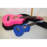 A child's acoustic guitar together with a Mahalo ukelele (2)
