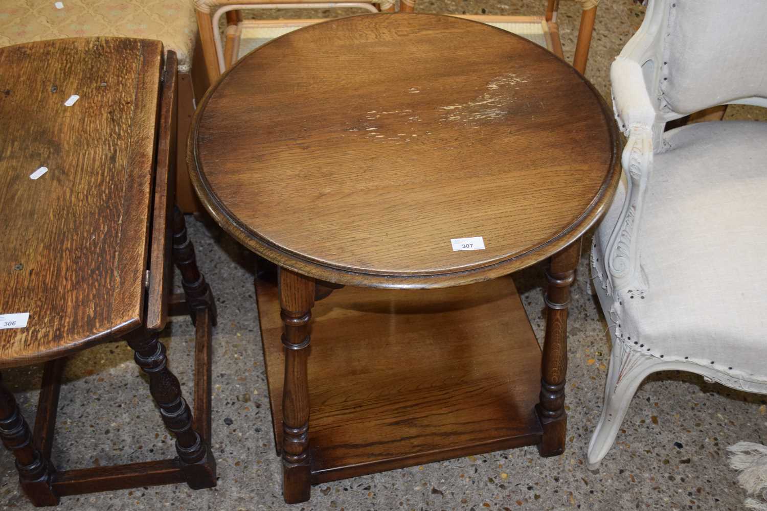 An oak two tiered occasional table