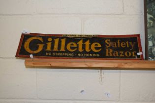 A metal and card backed advertising sign for Gillette Safety Razors