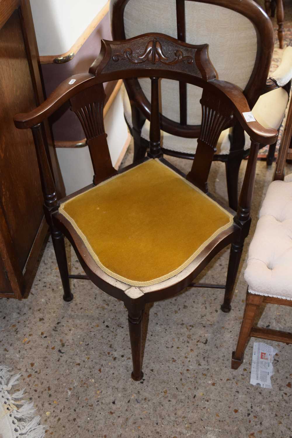 An Edwardian corner chair with mustard upholstered seat