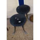 A pair of stools with cast aluminium bases