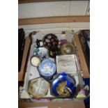 A box of various assorted paperweights and other items