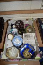 A box of various assorted paperweights and other items