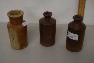 A group of three small stone ware bottles