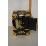 A modern Oriental black lacquered and brass mounted jewellery box