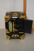 A modern Oriental black lacquered and brass mounted jewellery box