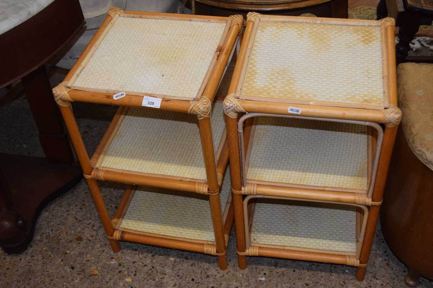 A pair of bamboo framed shelf units