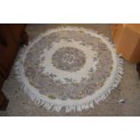 A Chinese circular wool floor rug