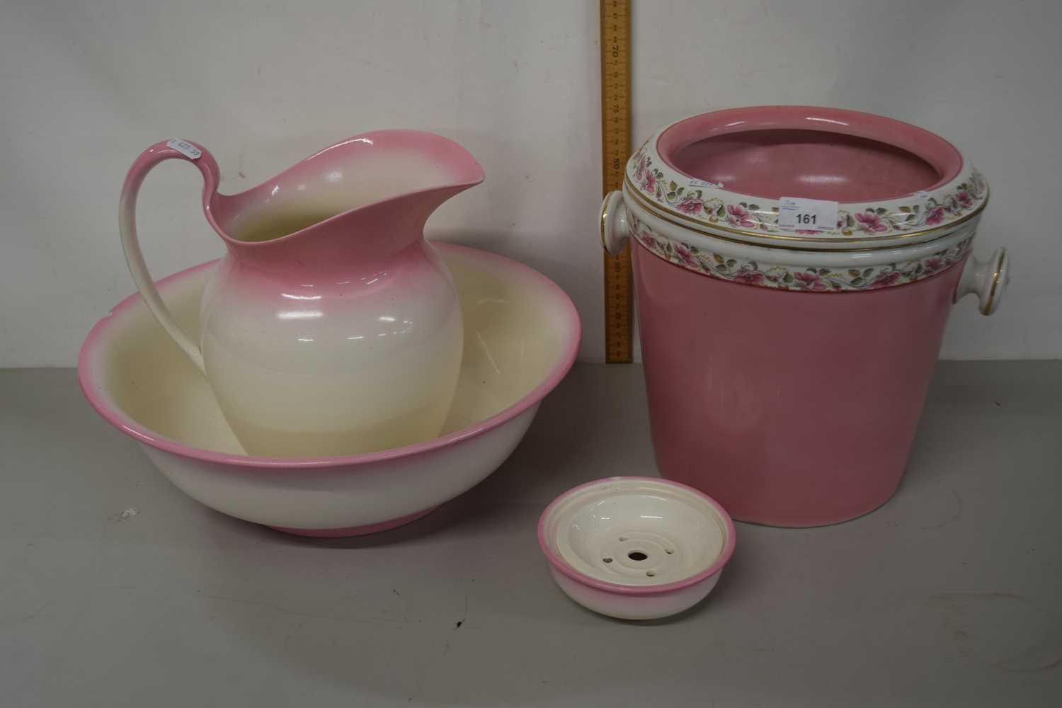 A pink and floral decorated dressing table set