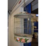 A decorative floral finished parrot cage