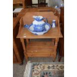 A pine wash stand containing a blue and white wash bowl, jug and other items by Cauldon