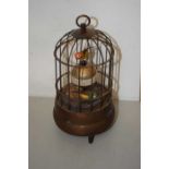 A small automaton singing bird in cage