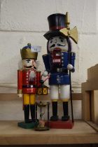Two novelty figural nut crackers and an egg timer
