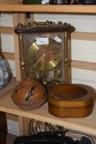 A 20th Century mantel clock together with a folding ashtray and a carved wooden ornament