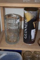 Modern Guinness glass and bottle opener together with a large glass tankard