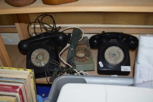 A group of three vintage telephones