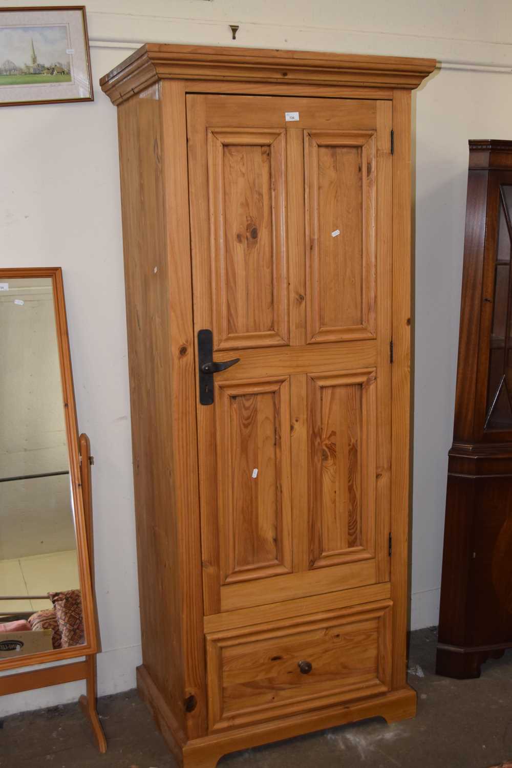 A modern pine single door wardrobe