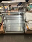 A glass bakery display unit