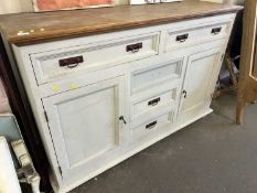 A distressed look painted sideboard