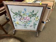 An embroidered fire screen