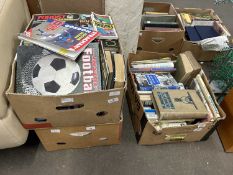 Three boxes containing a quantity of various books including engineering, science, football,