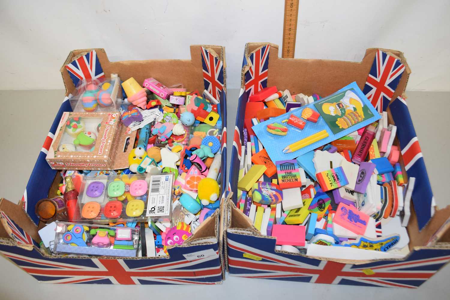 Two boxes containing a collection of vintage rubbers
