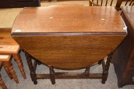 Early 20th Century oak drop leaf dining table on barley twist legs