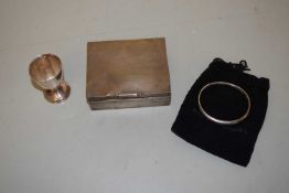 White metal cigarette case with engine turned decoration, a hallmarked silver egg cup and a
