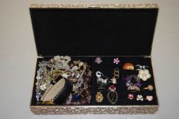 A case of assorted costume jewellery