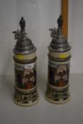 Pair of modern German beer steins with hinged metal lids