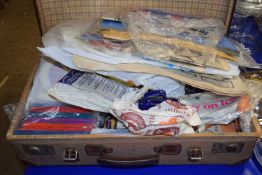 A suitcase containing various royal commemorative items, vintage newspapers and other ephemera
