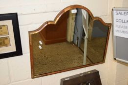 A walnut framed arch topped wall mirror